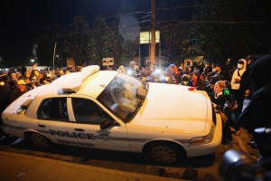 Mob_turning_over_police_car